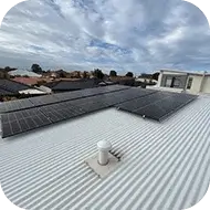 Solar panels installed on a community center roof, supporting local renewable energy initiatives