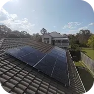 Solar panels installed on a community center roof, supporting local renewable energy initiatives