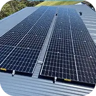 Solar panel setup on a house roof, reducing electricity bills with renewable energy