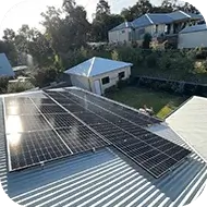 Solar panels installed on a home rooftop, providing clean energy for the household